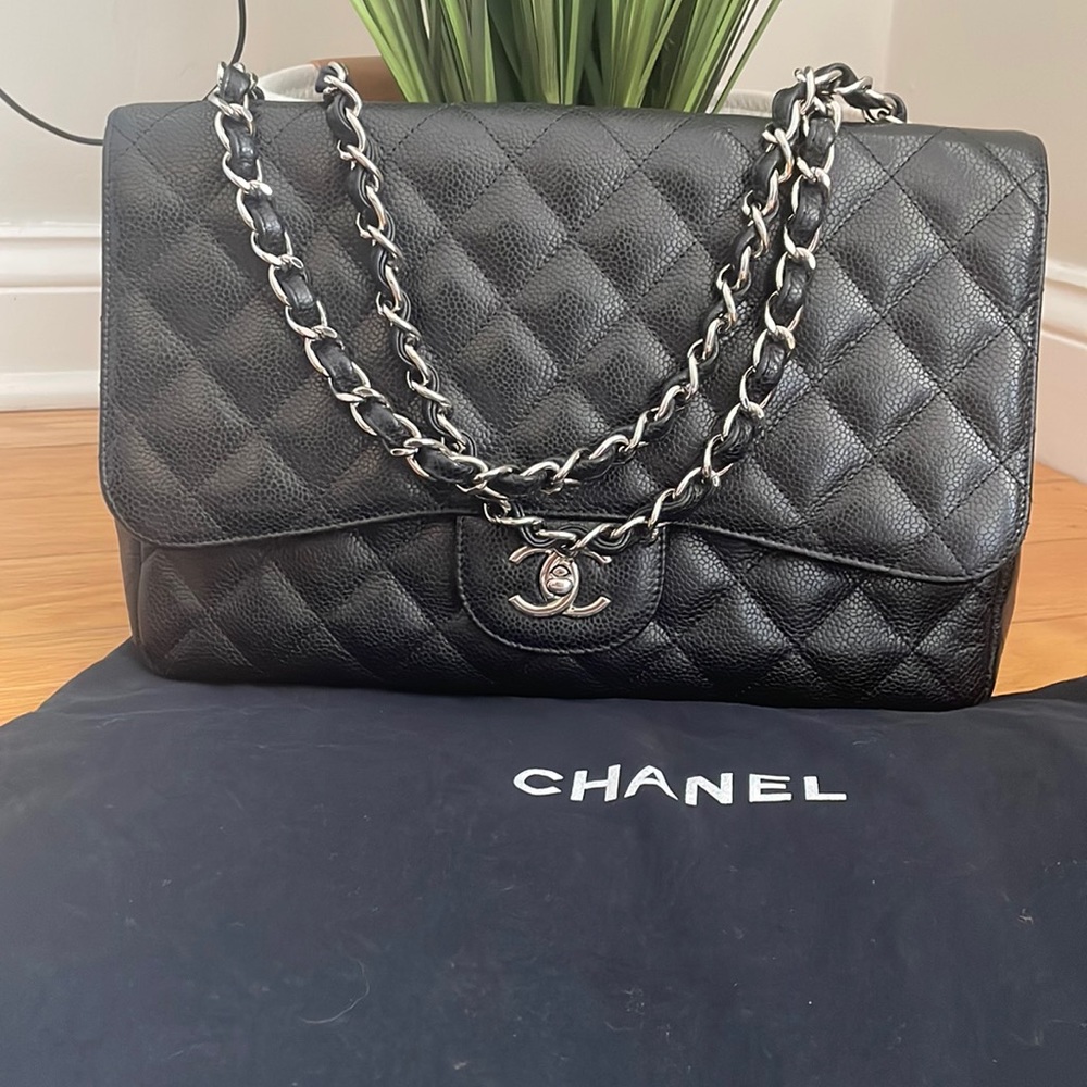 Chanel black quilted jumbo classic single flap bag in caviar leather